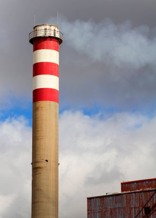 is a tower polluting over the skyの写真素材