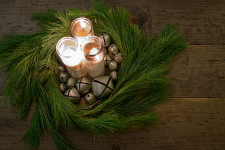 Christmas Wreath with bells and candles table decorationの写真素材