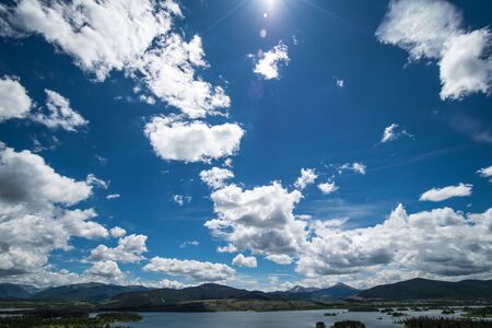 Blue Sky and clouds over mountain lake Lake Dillon, Coloradoの写真素材
