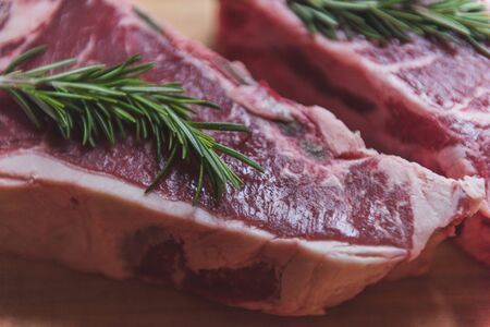 Raw Steak with Sea Salt and Rosemary ready to be cookedの写真素材