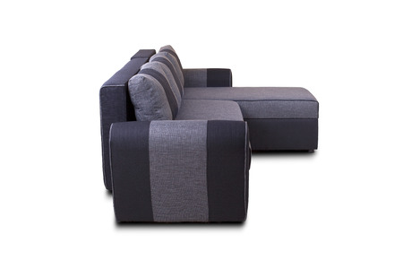 Studio shot of a grey modern sofa isolated on white background unknown modelの写真素材