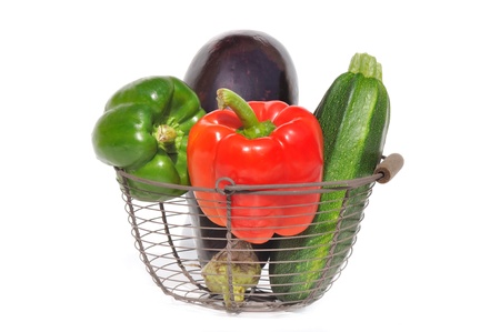 Fresh vegetables in basket on white backgroundの写真素材