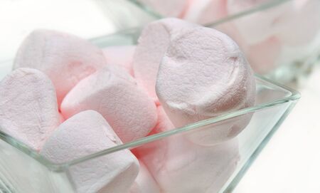 Small glasses filled with marshmallows pink の写真素材