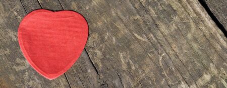 	 Heart-shaped confetti landed on wood