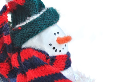 snowman wrapped in a scarf and a hatの写真素材