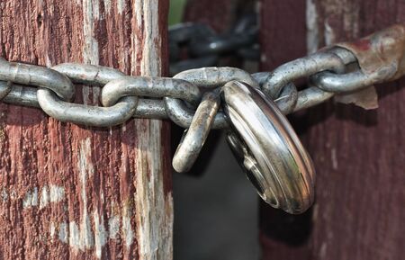 	 Close up of a chain padlocked steel