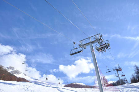 chairlifts carrying skiers to the slopes