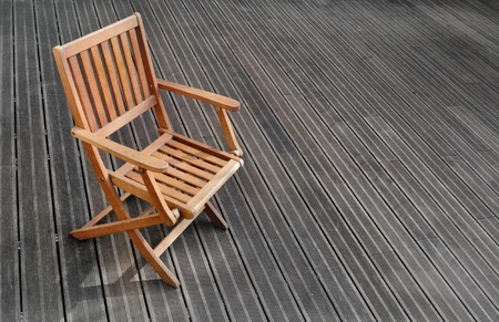 Empty chair on exotic wooden terraceの写真素材
