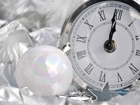 clock striking midnight silver in  holiday decorの写真素材