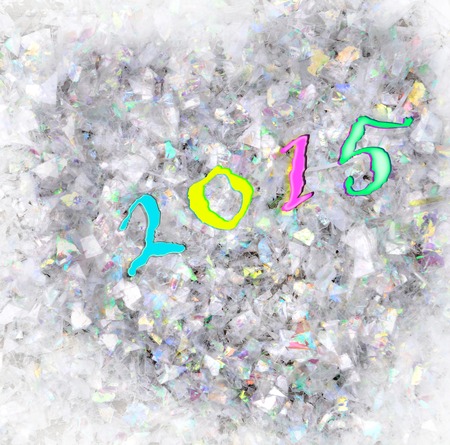 2015 on heart formed in transparent and colored confetti