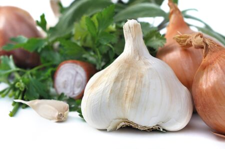 close on a garlic with other aromatics and herbs on white backgroundの写真素材