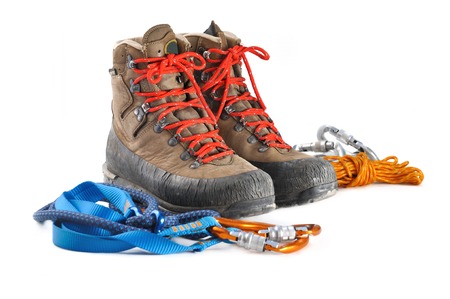 hiking shoes and mountaineering equipment on white backgroundの写真素材