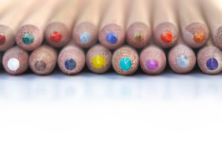 row of colored pencils on white backgroundの写真素材