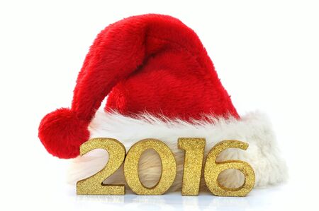 golden figures 2016 on a santa claus hat on white backgroundの写真素材