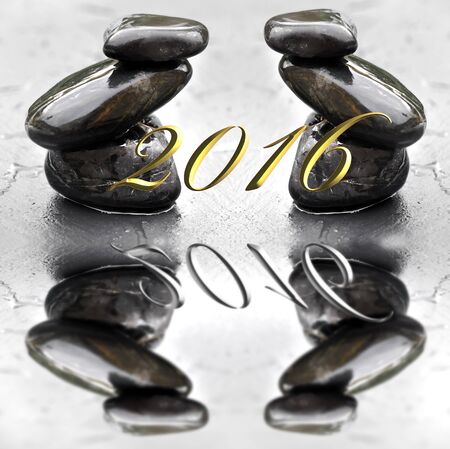 2016 greeting card balance pebbles on wet slate backgroundの写真素材