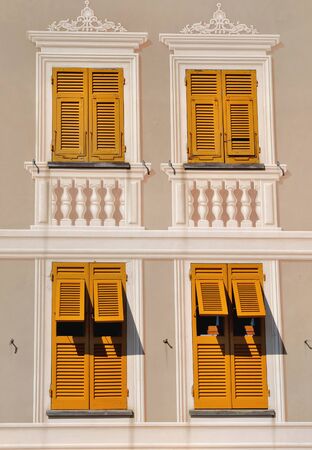 windows with shutters and facade painted in trompe l'oeilの写真素材