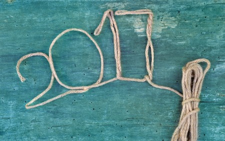 2017 drawn with a string on blue wooden background