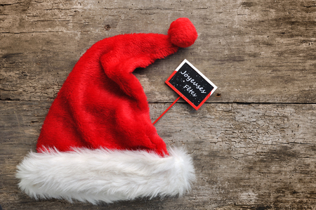 santa fur cap with a little panel writting Happy holidays in frenchの写真素材