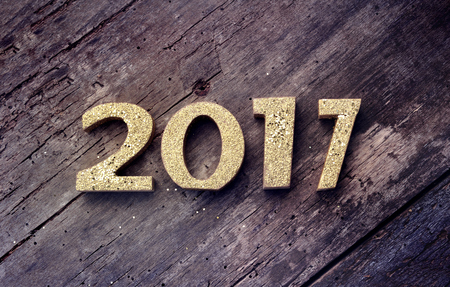 golden 2017 figures on a old plank