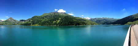 landscape with a beautiful lake of a dam with road の写真素材