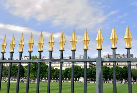 fence of Tuilerie garden at Paris with golden points の写真素材