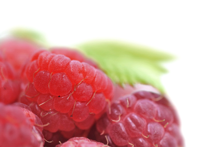 closeup on fresh raspberries on white background 