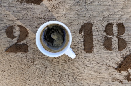cup of coffee and 2018 written with ground coffeeの写真素材