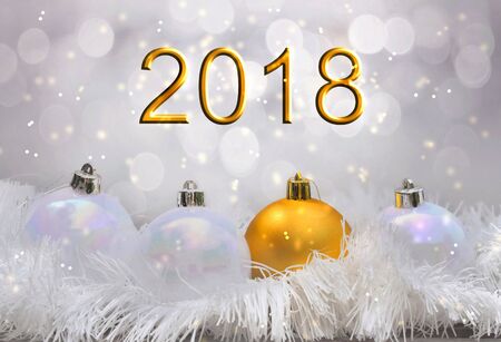 2018 and christmas ball on blur lights effectの写真素材