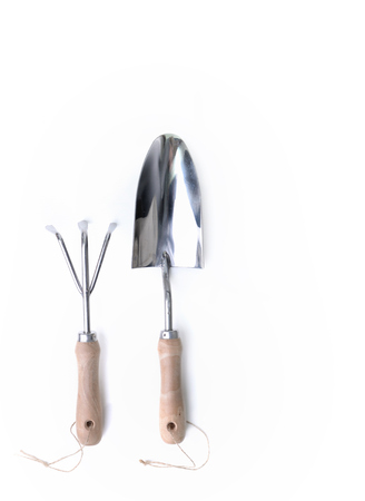 shovel and garden claw in metal with wooden handle isolatedの写真素材