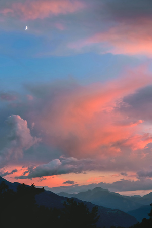 beautiful sunset on the sky above mountain