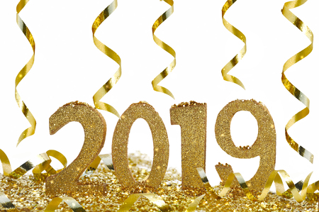 golden figures for new year 2019 and ribbons on white backgroundの写真素材