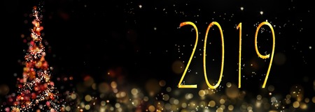 2019 written on abstract night next to a christmas tree in panoramic size
