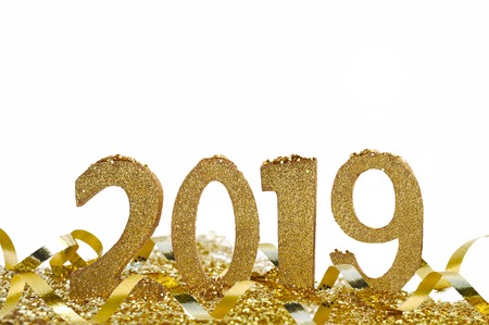 2019 in golden figures standing in ribbon and glitters on white background