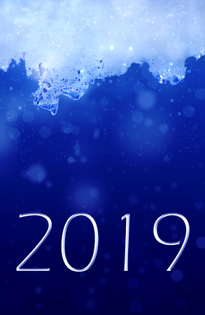 2019 new year on blue background and ice on the topの写真素材