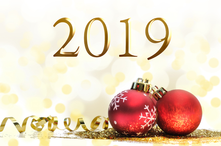 2019 new year and christmas ornements on golden glittersの写真素材