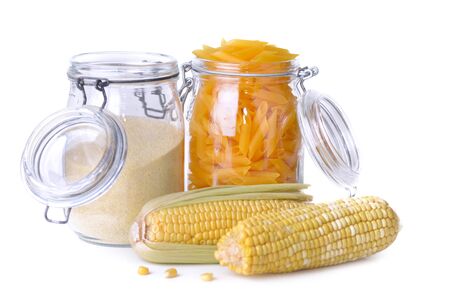 gluten free pasta and flour in  jars and fresh corn on white backgroundの写真素材