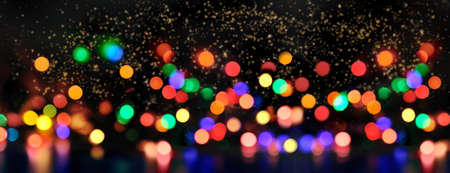 colorful blur light in golden confetti in the night in panoramic view