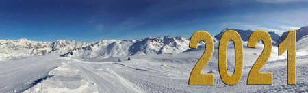 2021golden figures textured with glitters on ski slopes in european alps in panoramic view...