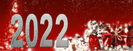 2022 figures on gifts and abstract tree background