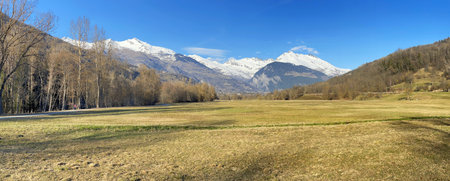 beautiful scenic panorama in alpine mountain snowy and large meadow in Savoy, Europeの写真素材