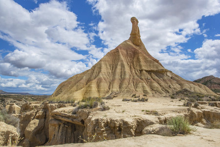 View of Castildetierra, the famous fairy chimney of the Bardenas Reales desert in Spain under cloudy skyの写真素材