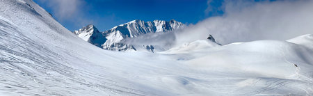 Panoramic view of the mountains in winter resort alpine ski station in Savoy Franceの写真素材