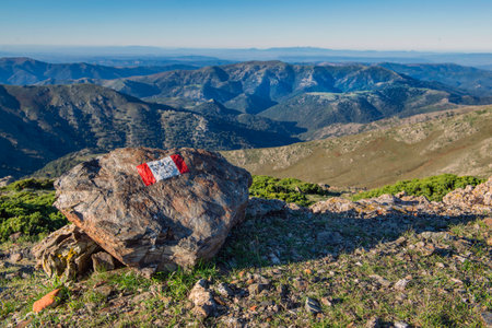 sign drawing on a rock of hiking path at the summit of mountain in national park Gennargentu in Sardinia, Italyの写真素材
