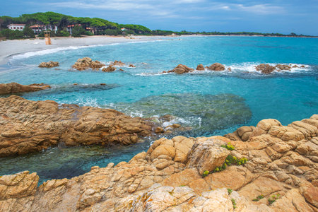 beautiful water transparent and blue of a sea in a Sardinia beach with granite rockの写真素材