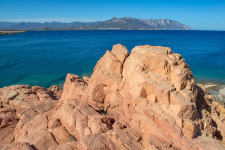 red granite rock on the edge of a the sea in Sardinia Italy - Rocce Rosse Arbataxの写真素材
