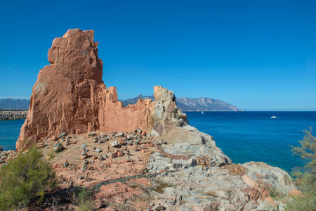 formation of red granite rocky peak on clear sea in Sardinia Italy - Rocce Rosse Arbataxの写真素材