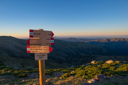 direction sign of hiking in mountain in national park Gennargentu in Sardinia at sunsetの写真素材