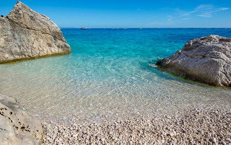 beautiful beach of cala Goloritze in Sardinia-Italy, with turquoise and crystalline sea between rockの写真素材