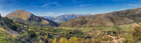 beautiful panorama in mountain landscape with hill and peaks in the background in the region of Konispol Markat Albaniaの写真素材