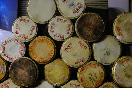 A pile of round musical instruments called drums stacked one on top of each other as seen from one side on 12 September 2019 at Pune Maharasthra Indiaのeditorial素材